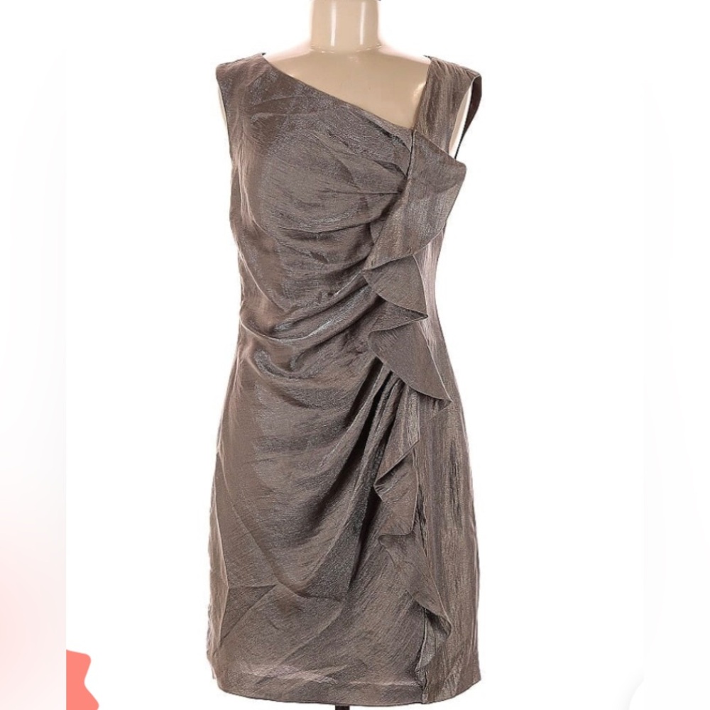 Beautiful cocktail dress in a light shimmer platinum gold fabric. Size 8.
